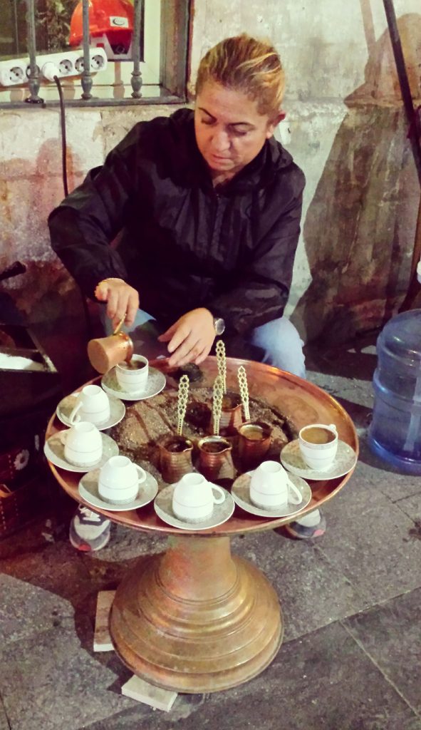 Lady Preparing Coffee the Traditional Way